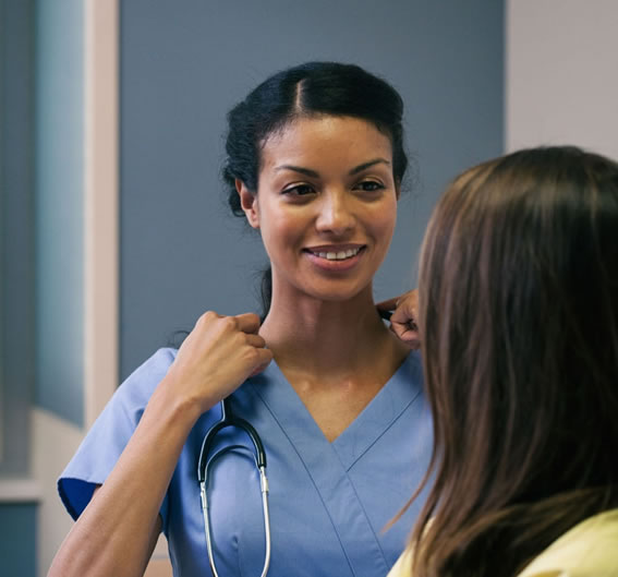 Indiana cost page hero-nurse-smaller A clinician and patient discussing how much an abortion costs.